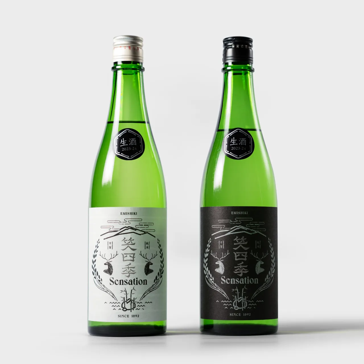 Two green glass bottles of Sensation sake with white and black labels featuring a deer illustration, designed by Hokuto Kudo